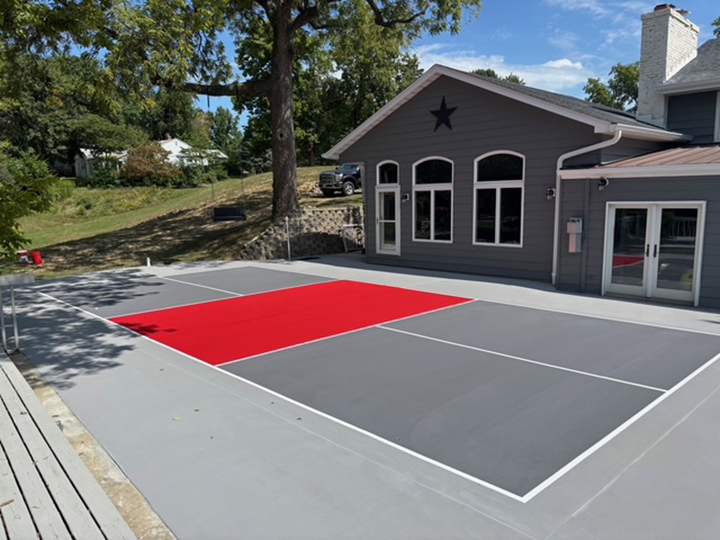 resurfaced outside pickle ball court using gray and red colors